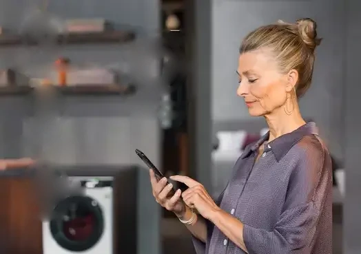 Customer booking an AEG appliance repair by phone in Dubai